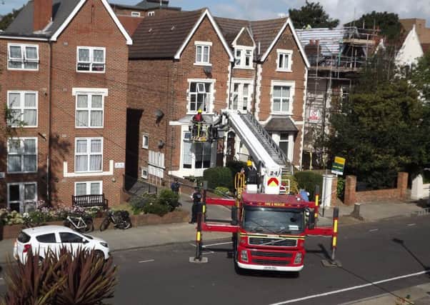 Firefighters at the scene of the death in Outram Road, Southsea