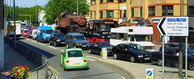 Nothing changes... a 2006 traffic jam in Commercial Road, Portsmouth, with a steam engine giving drivers something different to ponder while they wait.