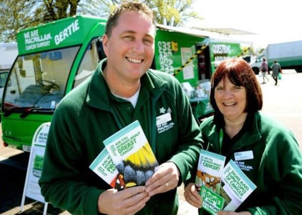 (From left) Phil Warner (Facilities Officer) and Elaine Perry (Information Specialist) with Bertie, the Macmillan Mobile Information Bus