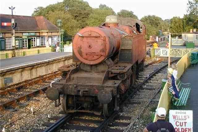 Locomotive 41313 is propelled towards the mechanical engineering workshop at Havenstreet, Isle of Wight , the day she arrived in the island via Portsmouth.