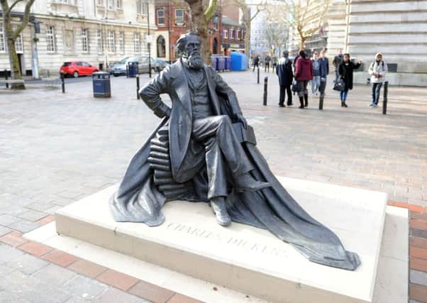 The statue of Charles Dickens in Guildhall Square, Portsmouth