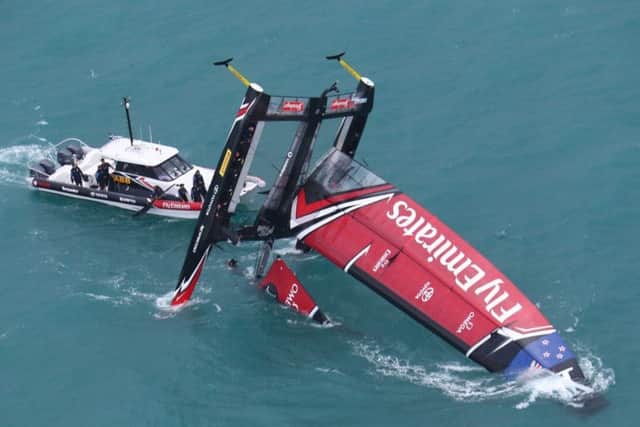 Emirates Team New Zealand capsized against Land Rover BAR. Picture: Gilles Martin-Raget/ America's Cup