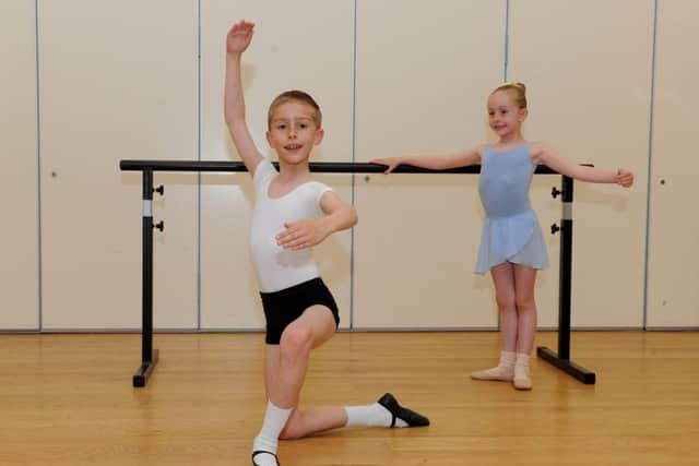 Callum Finch (nine) from  Southsea, during rehearsals with his proud sister Chloe (six) Picture: Sarah Standing (170725-2990)