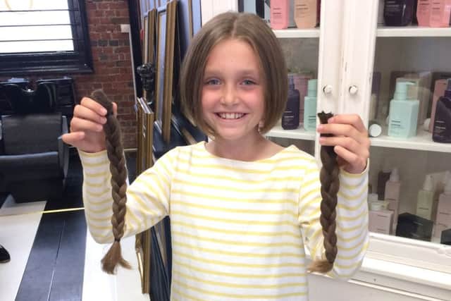 Martha Swaddling, 9, had her hair cut off for charity