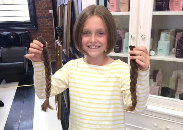Martha Swaddling, 9, had her hair cut off for charity