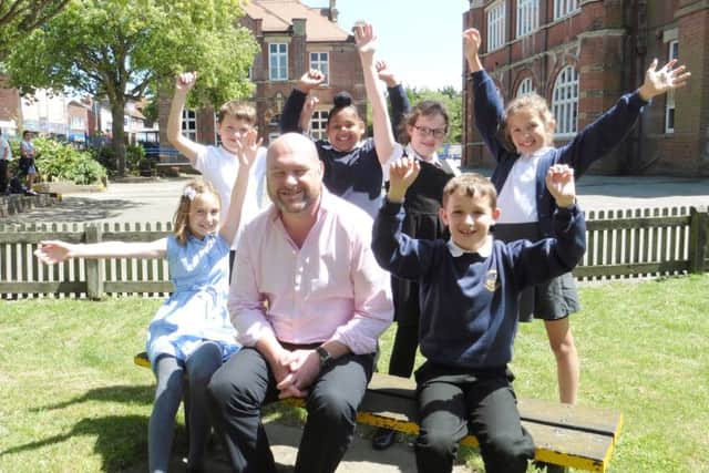 Standing l to r: Noah Martin (10), Nindy Singh (10), Casey Blair (9), Gracie Novakovic (10) Sitting l to r: Freya Hawkes (10), headteacher David Jones and Oliver Mitchell (10)  Picture: Kieran Davey