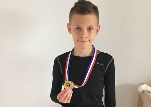 Jake Gifford with his under-10s British title medal PPP-170806-165713001