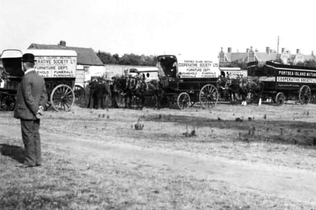 Horse-drawn wagons belonging to the Co-op on show on Southsea Common .
