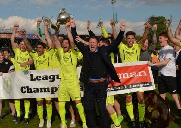 Lee Bradbury and his Hawks celebrate the Ryman League premier division title