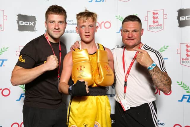 Tommy Maggs, centre, with his Titchfield coaches. Picture: England Boxing/Chris Bevan