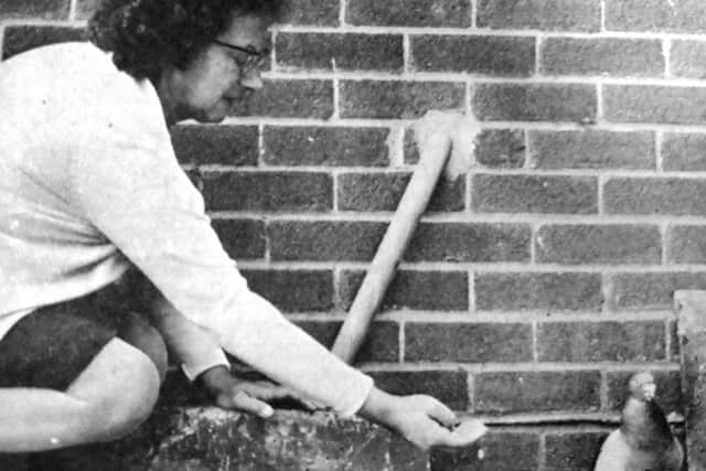 Walter the pigeon with Marie Boyd, who took him in