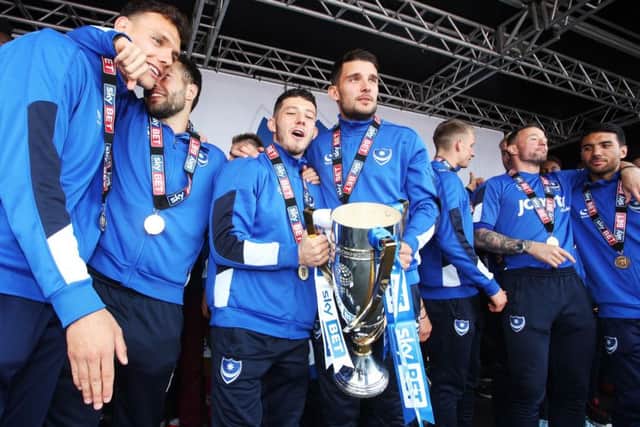 Conor Chaplin and Gareth Evans with the League Two trophy and wear their winners' medals. Picture: Joe Pepler PPP-170905-094948001