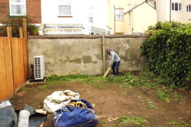 NOW: The same garden today. Martin Boateng stands in for the original batsman.