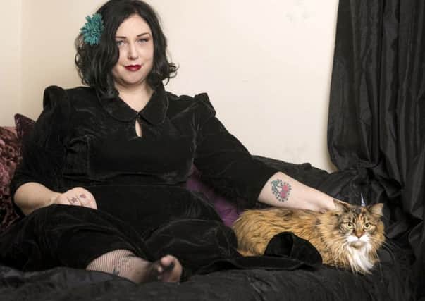 Anastasia-Camille Glover, with her cat Sadie Ellenore

Picture: Christopher Ison/PA Wire