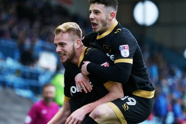 Conor Chaplin celebrates with Jack Whatmough following the defenders goal against Carlisle last season