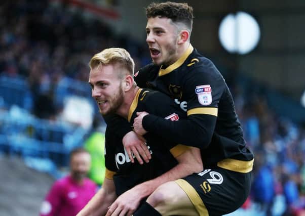 Conor Chaplin celebrates with Jack Whatmough following the defenders goal against Carlisle last season
