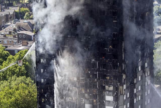 Smoke billows from a fire that engulfed the 24-storey Grenfell Tower in west London Picture: Rick Findler/PA Wire