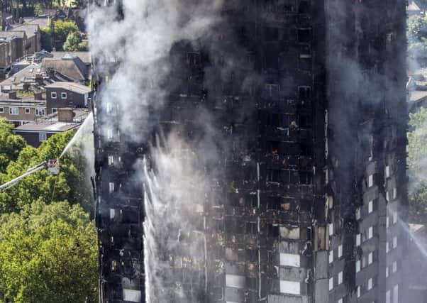 Smoke billows from a fire that engulfed the 24-storey Grenfell Tower in west London Picture: Rick Findler/PA Wire