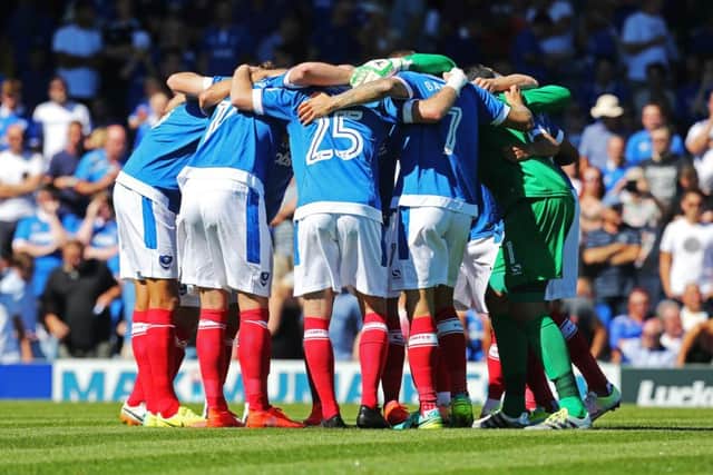 Pompey huddle for the first game of the 2016-17 season against Carlisle. Picture: Joe Pepler