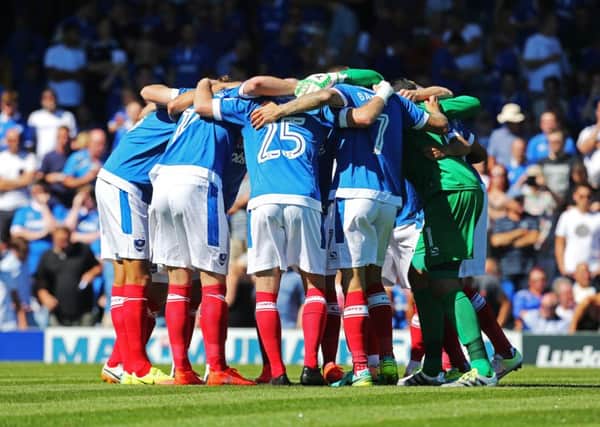 Pompey huddle for the first game of the 2016-17 season against Carlisle. Picture: Joe Pepler
