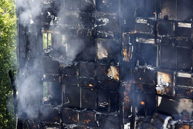 Smoke billows from a fire that has engulfed the 24-storey Grenfell Tower in west London