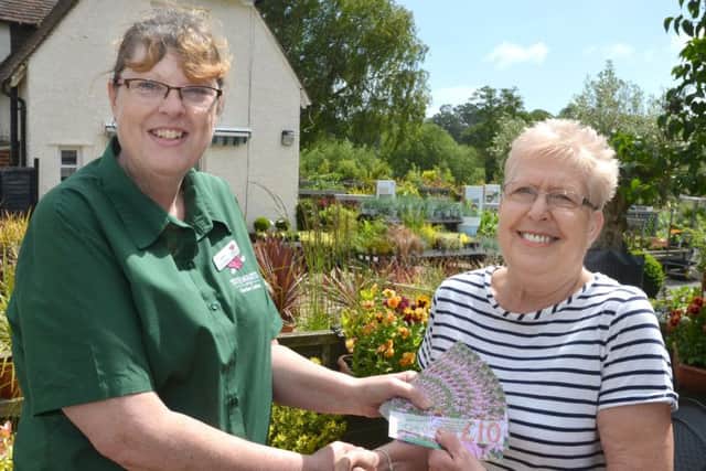 Centre Manager Jackie Avis with winner Sandra Murray