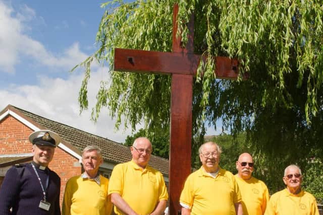 The team from Gosport Men's Shed with the refurbished cross at HMS Collingwood
