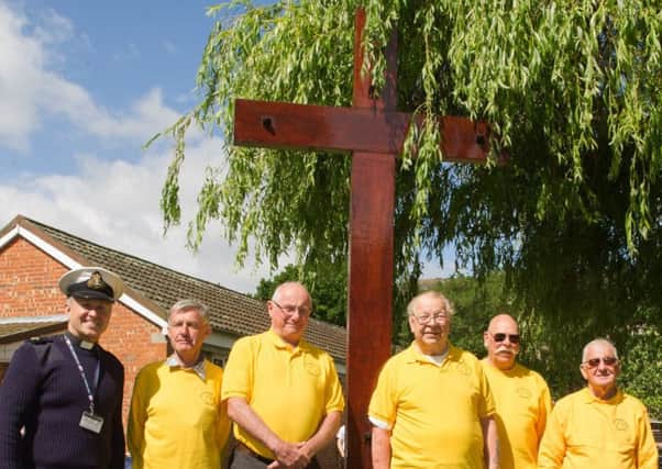 The team from Gosport Men's Shed with the refurbished cross at HMS Collingwood