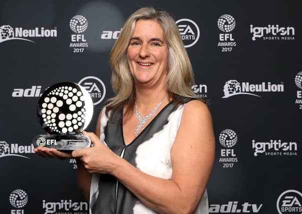 Clare Martin collects Pompey's community club of the year trophy at the EFL Awards
