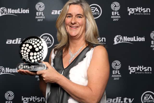 Clare Martin collects Pompey's community club of the year trophy at the EFL Awards