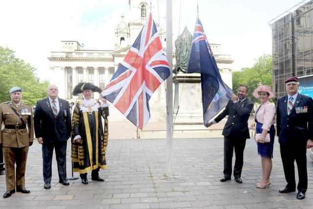 A flag is raised  in Guilkdhall Square, Portsmouth, to mark the 35th anniversary of the liberation of the Falkland Islands     Picture: Sarah Standing (170730-3232)