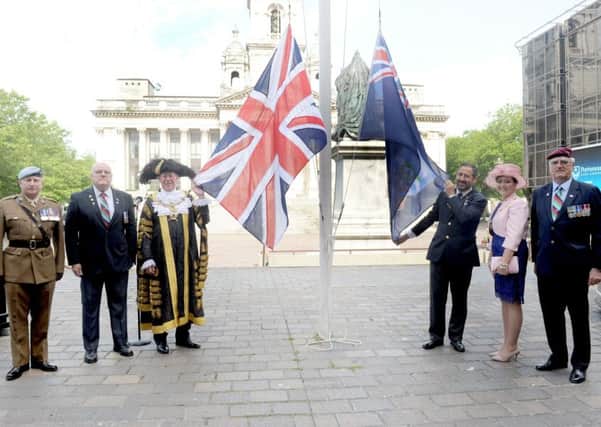 A flag is raised  in Guilkdhall Square, Portsmouth, to mark the 35th anniversary of the liberation of the Falkland Islands     Picture: Sarah Standing (170730-3232)
