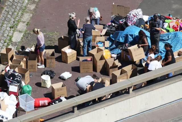 Volunteers sort through donations near Grenfell Tower