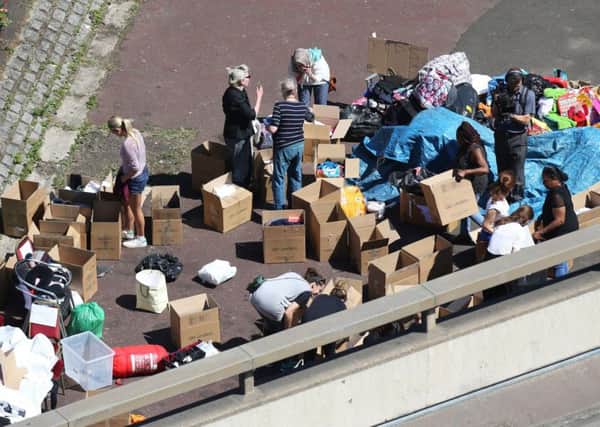 Volunteers sort through donations near Grenfell Tower