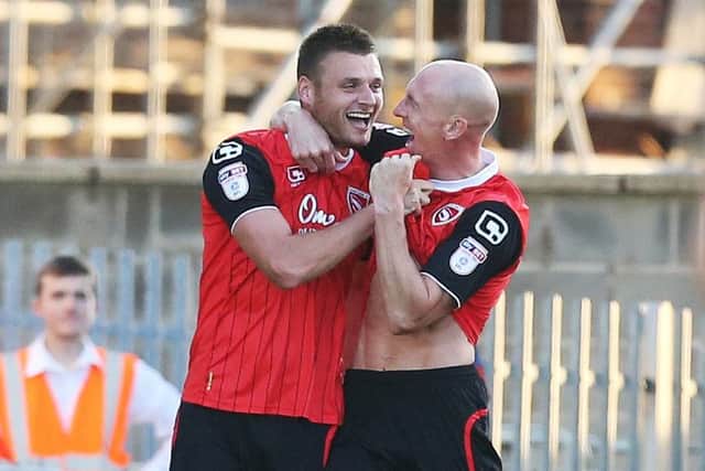 Ryan Edwards celebrates his goal for Morecambe against Pompey. Picture: Joe Pepler