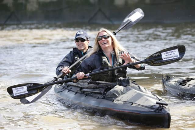 Jodie Kidd with Special Boat Service Association members paddling along the River Thames through central London.
Picture: Yui Mok/PA Wire