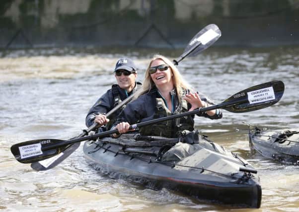 Jodie Kidd  with Special Boat Service Association members paddling along the River Thames through central London.
Picture: Yui Mok/PA Wire