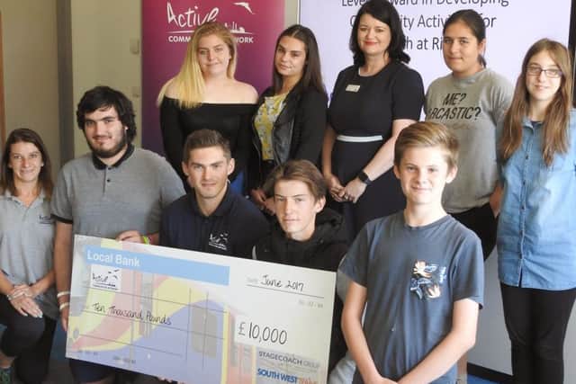 ACN staff and young leaders receive the cheque at Park Community School, where they were completing a Level 1 course