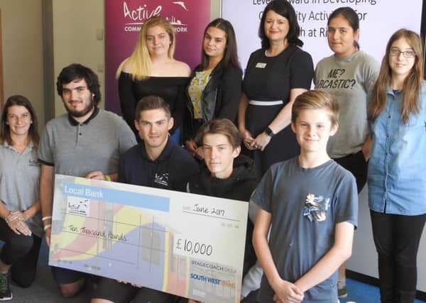 ACN staff and young leaders receive the cheque at Park Community School, where they were completing a Level 1 course