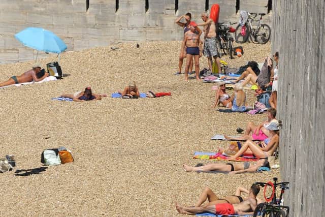 Sun worshippers were out in force at The Hot Walls in Old Portsmouth  Picture:  Malcolm Wells (170619-1764)
