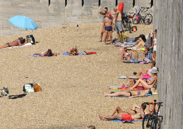 Sun worshippers were out in force at The Hot Walls in Old Portsmouth  

Picture:  Malcolm Wells (170619-1764)