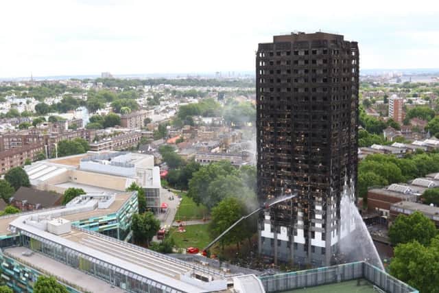 Water is sprayed on Grenfell Tower in west London