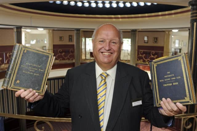 John Alderson general manager at the Royal Maritime Club in Portsmouth with the club's two historical visitors' books. 
Picture: Ian Hargreaves