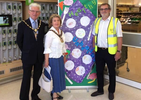 Cllr Gerald Shimbart, Cllr Elaine Shimbart, the mayor of Havant, and David Crichton who organised the art trail, in Waitrose