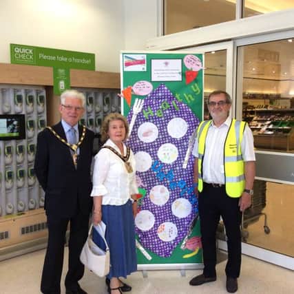 Cllr Gerald Shimbart, Cllr Elaine Shimbart, the mayor of Havant, and David Crichton who organised the art trail, in Waitrose