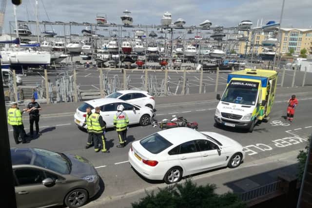 Emergency services at the scene on Mumby Road, in Gosport, where a motorcyclist was taken to hospital with serious injuries.