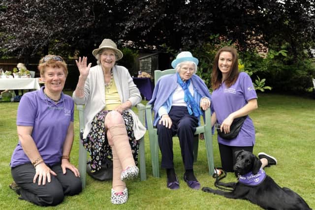 Chris Turner of Canine Partners with Gloria Edwards, Iris Silvester, and Kerry Walter with Whisper who is still under a strict training regime, at The Avenue care home, in Fareham
Picture by Malcolm Wells (170616-9723)