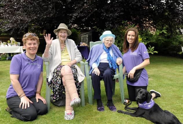 Chris Turner of Canine Partners with Gloria Edwards, Iris Silvester, and Kerry Walter with Whisper who is still under a strict training regime, at The Avenue care home, in Fareham
Picture by Malcolm Wells (170616-9723)