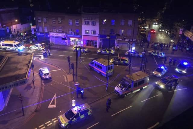 Emergency services at the scene in Seven Sisters Road. Picture: Thomas Van Hulle/PA