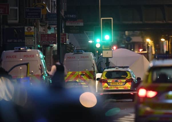 A police forensic tent is erected at the scene of the attack. Picture: PA